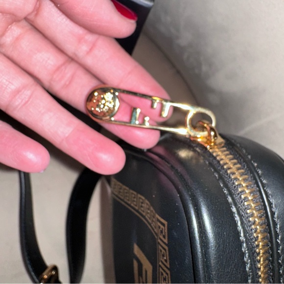 Authentic FENDACE Camera Crossbody
Fendi x Versace Collaboration | Black & Gold - Picture 5 of 14